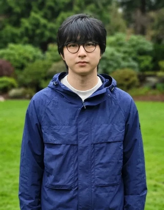 Chris Park standing outside in a blue jacket